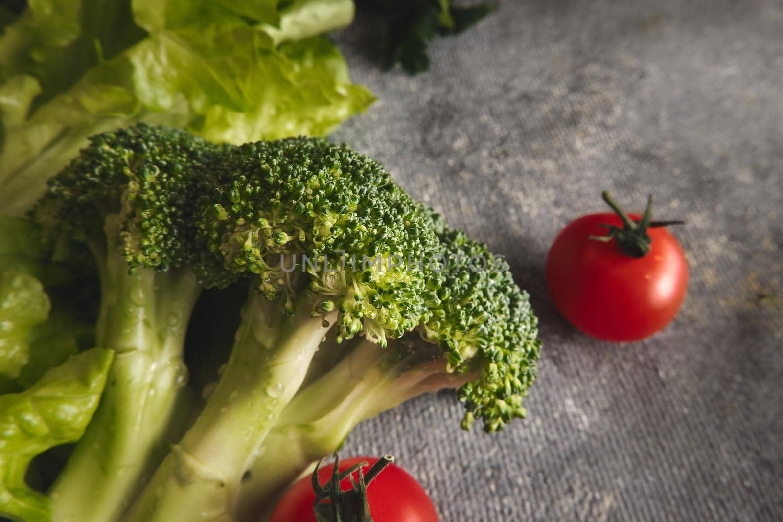 Fresh vegetables on gray background