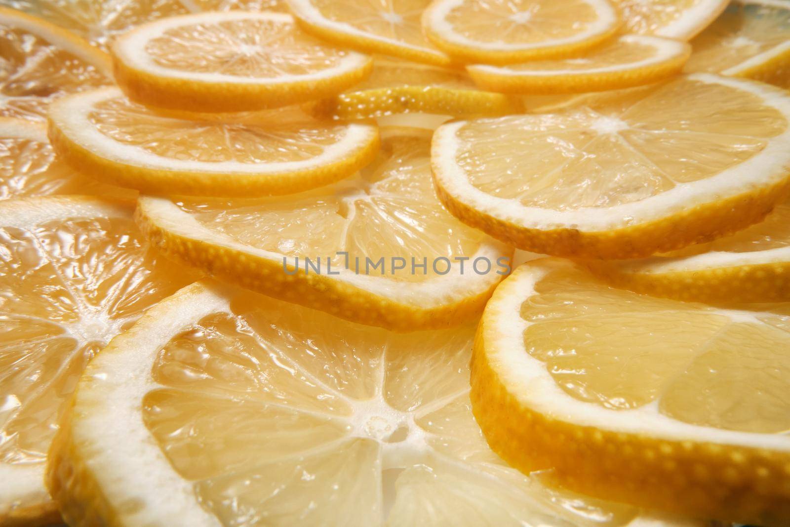 Fresh lemon lies on a blue textured background