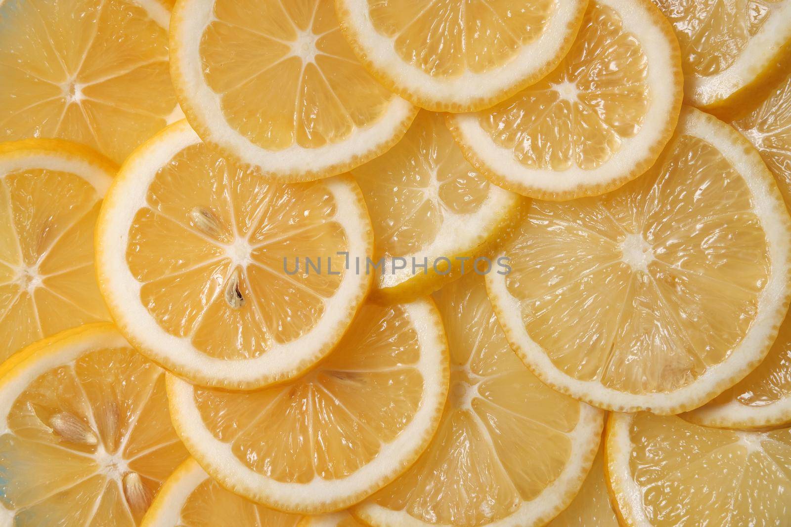 Fresh lemon lies on a blue textured background