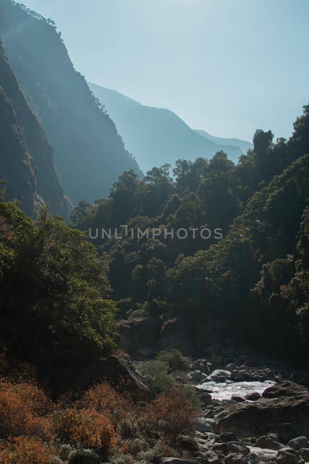 Marshyangdi river flowing underneath the surounding mountains by arvidnorberg