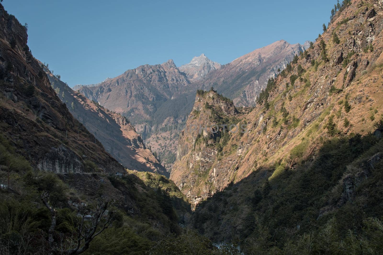 Mountains by the Marshyangdi river gorge valley by arvidnorberg