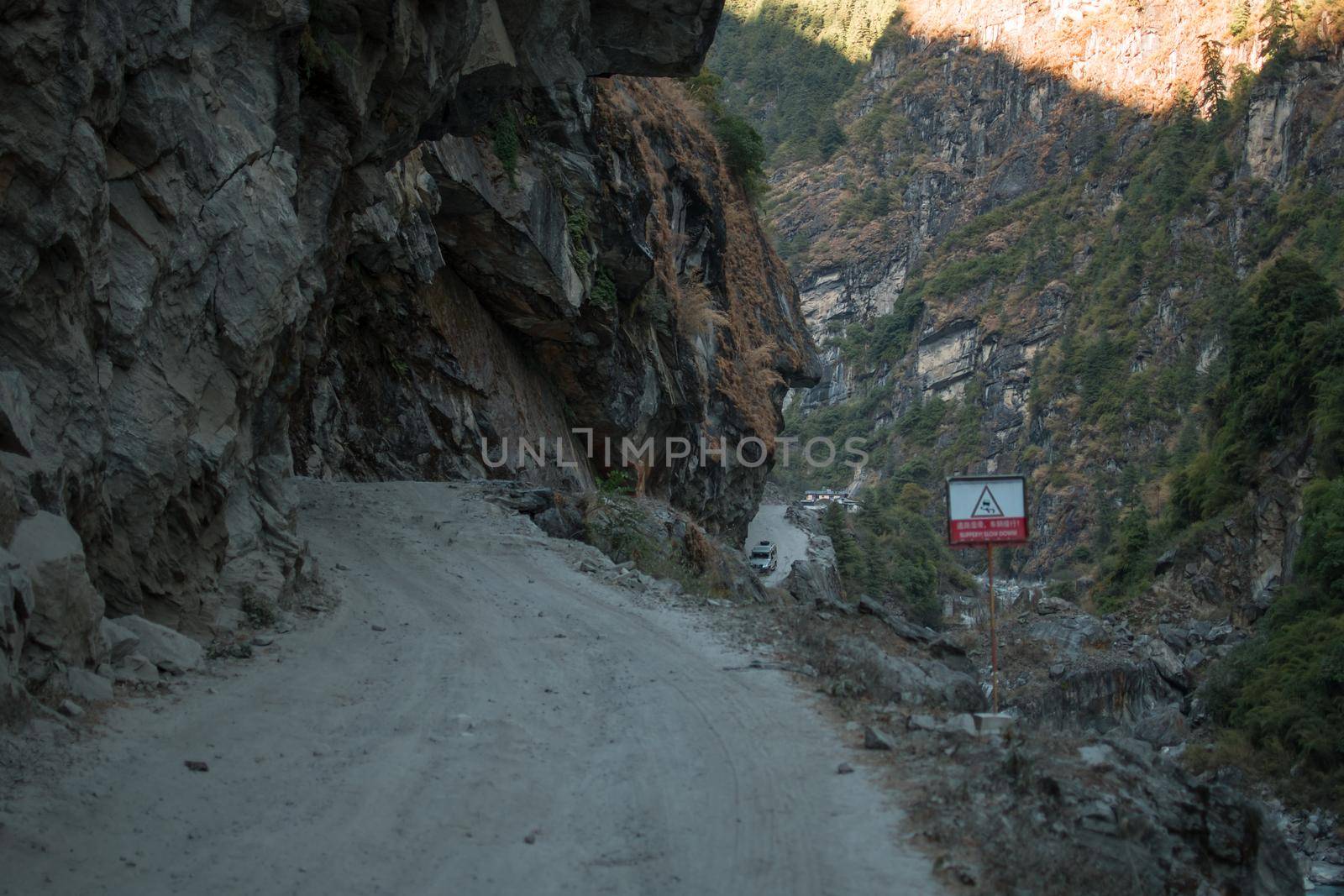 Dangerous curvy winding mountain road at Dharapani village over Marshyangdi river, Annapurna circuit, Himalaya, Nepal, Asia