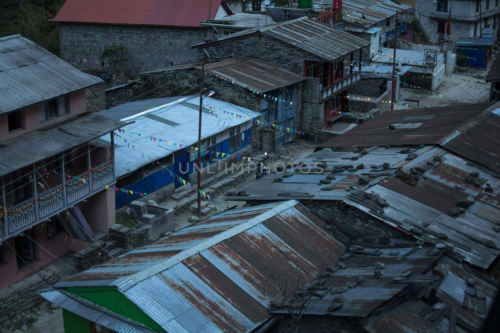 View over the mounatin village Dharapani with prayer flags by arvidnorberg