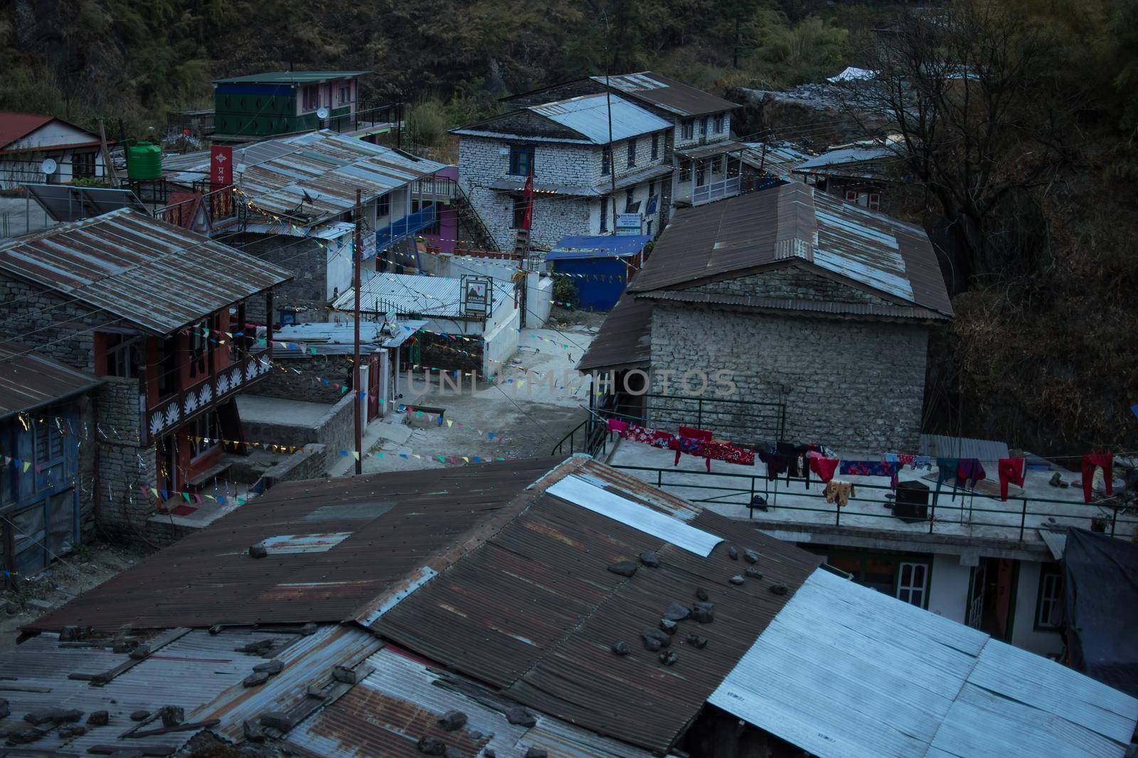 View over the mounatin village Dharapani with prayer flags along Annapurna circuit, Himalaya, Nepal, Asia