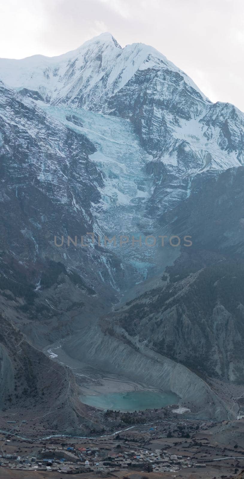 Mountain glacier over Manang village by arvidnorberg