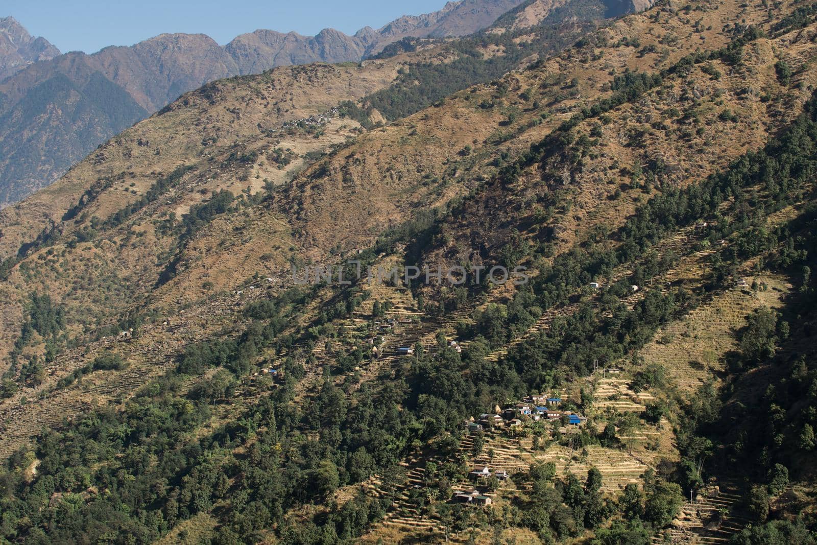 View over huts and terraced rice fields at Annapurna circuit in Nepal