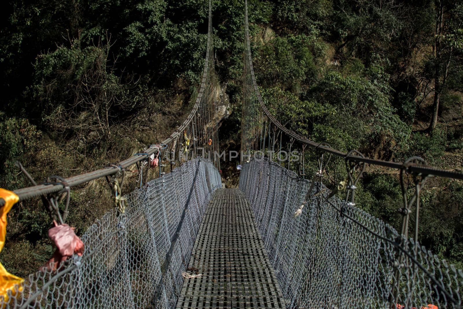 A simple suspension bridge crossing during the Annapurna circuit in Nepal