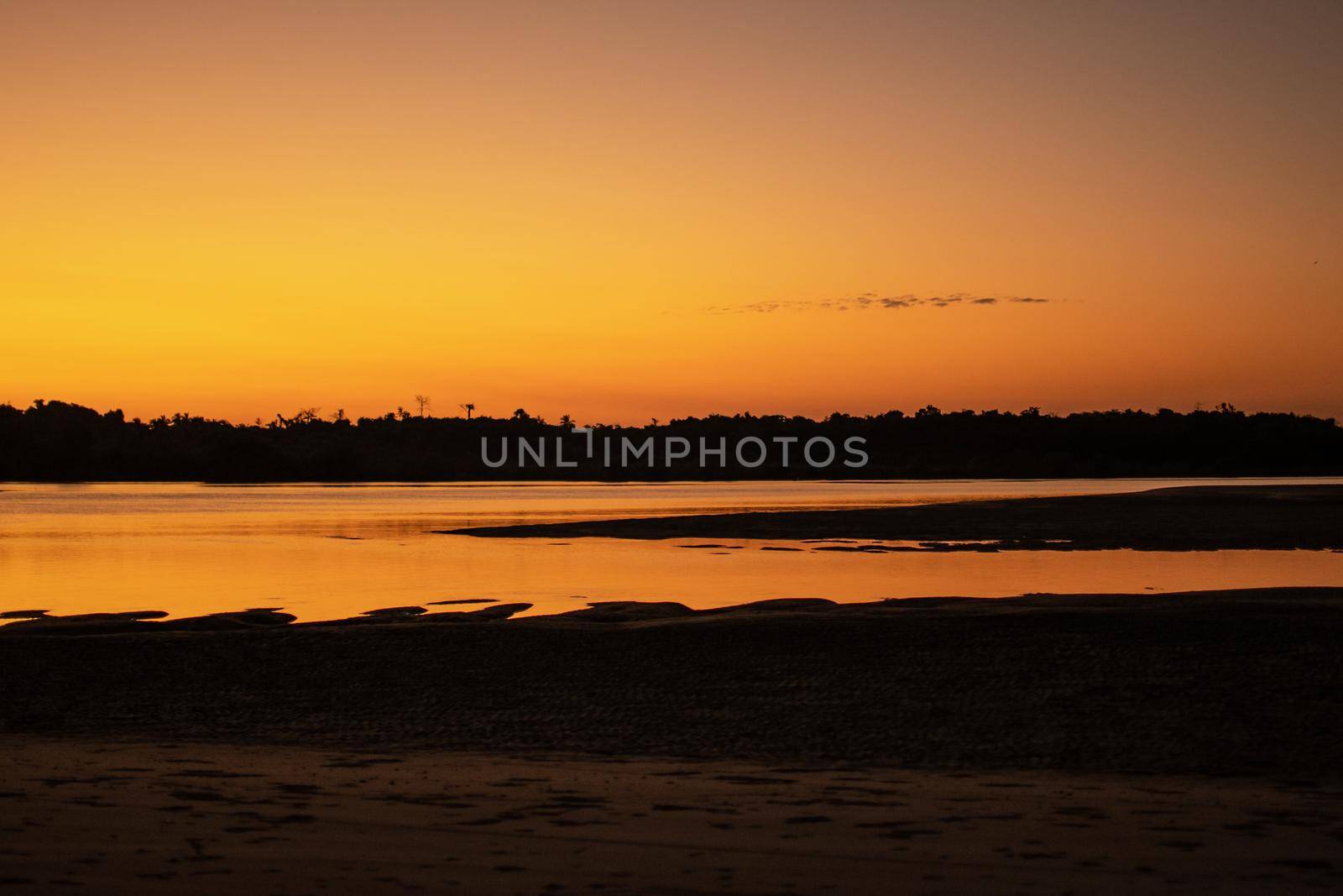 A sand beach during low tide and sunset near Ngwesaung, Myanmar by arvidnorberg