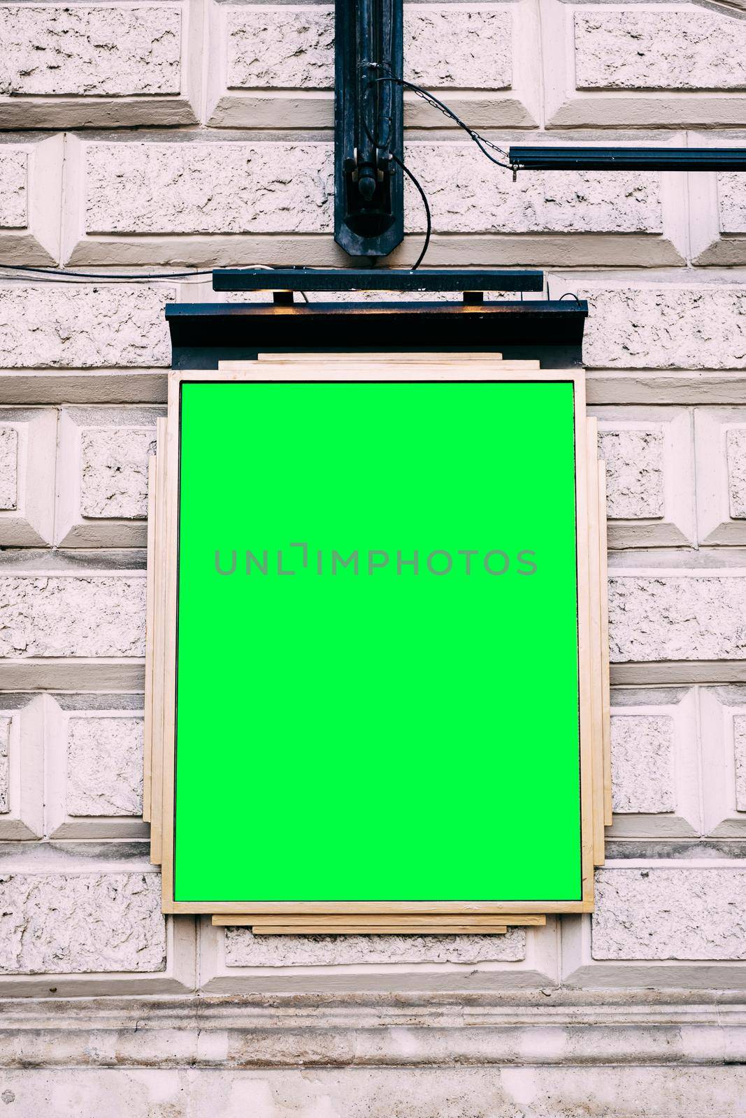 Plaque with blank background hanging on brick building. High quality photo