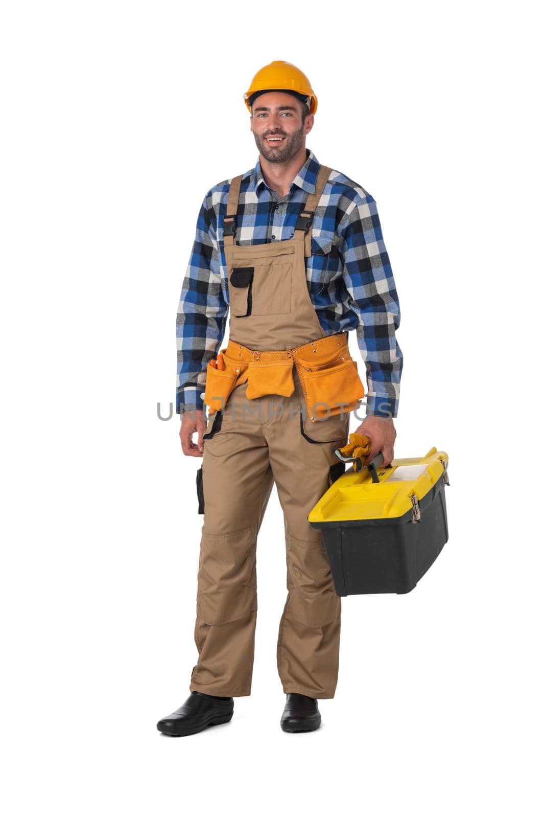 Contractor worker in coveralls and hardhat with toolbox isolated on white background, full length portrait
