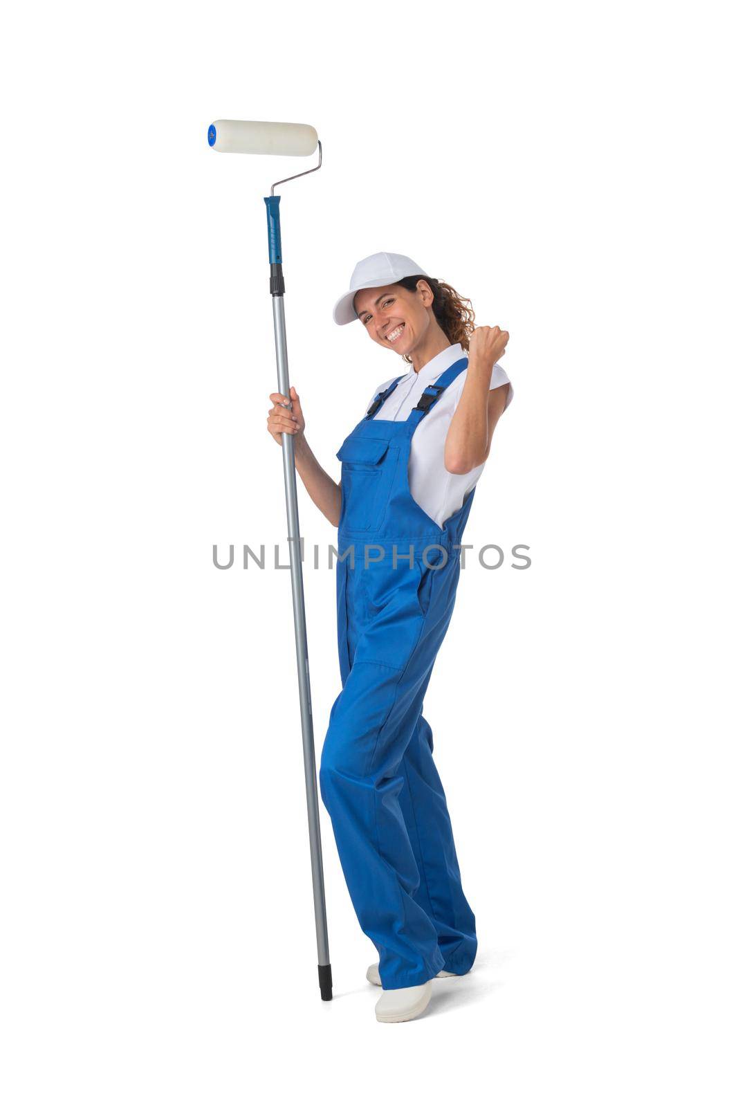 Female house painter with paint roller holding fists isolated on white background full length studio portrait