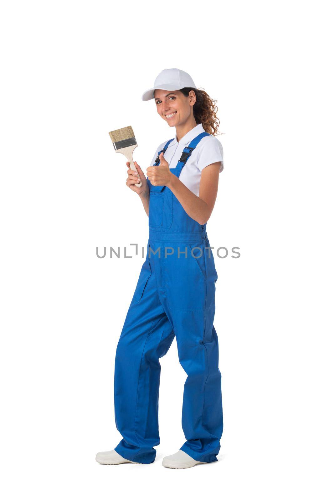 Female house painter with paint brush isolated on white background, full length portrait