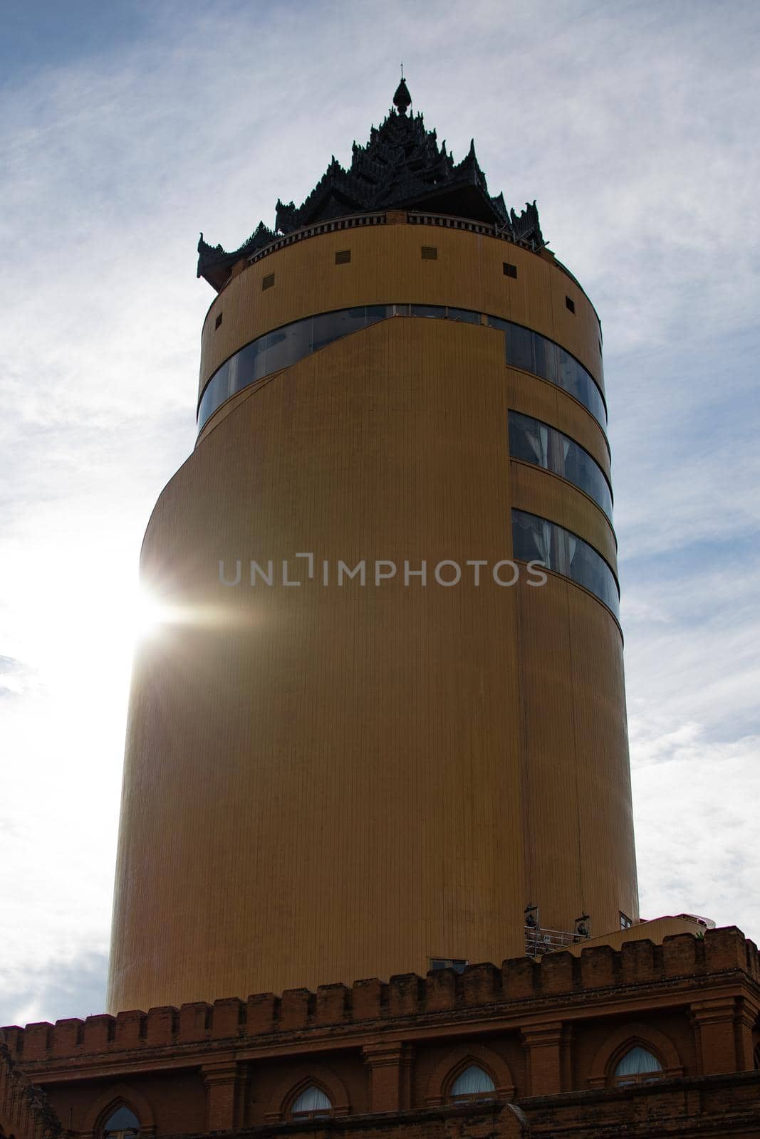 BAGAN, NYAUNG-U, MYANMAR - 3 JANUARY 2020: Looking up at the tall Nan Myint viewing tower with a bright sunflare shining through on one side