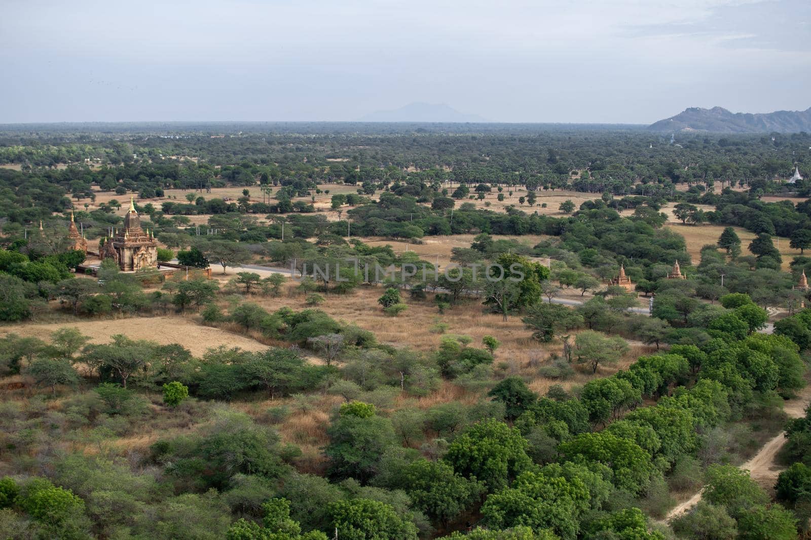 BAGAN, NYAUNG-U, MYANMAR - 3 JANUARY 2020: Looking out over the vast plains of Bagan with its historical temples and fields from the tall Nan Myint viewing tower