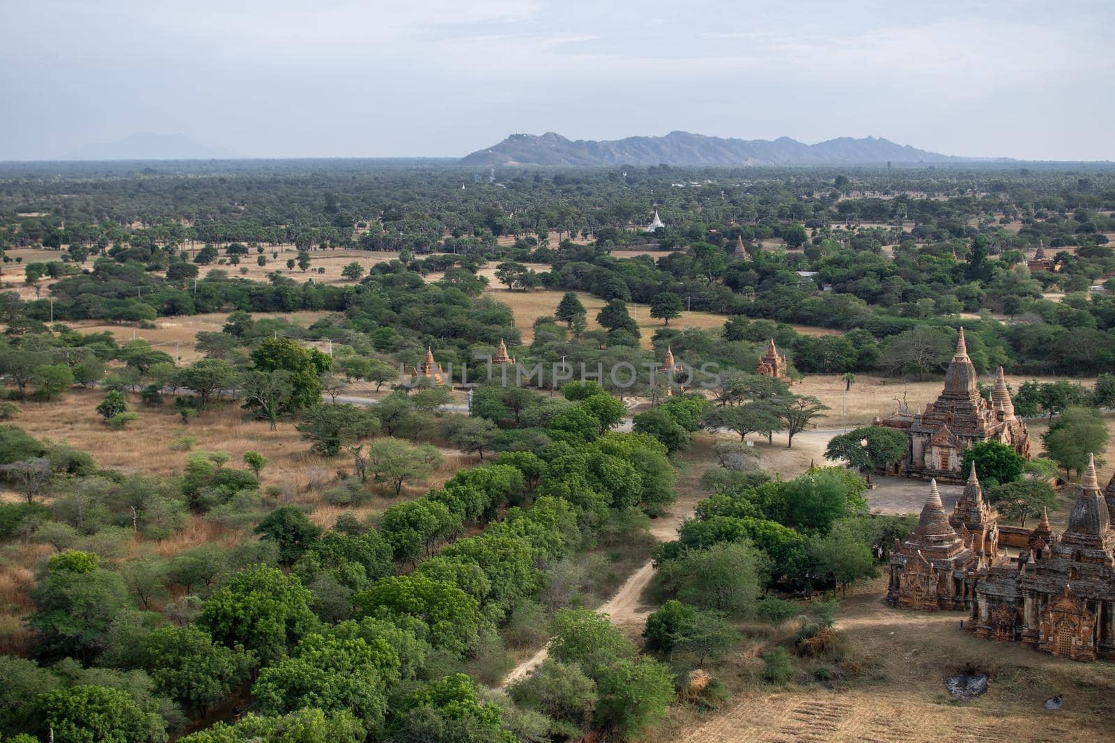 BAGAN, NYAUNG-U, MYANMAR - 3 JANUARY 2020: Looking out over the vast plains of Bagan with its historical temples and fields from the tall Nan Myint viewing tower