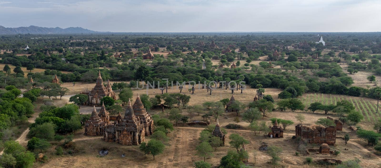 BAGAN, NYAUNG-U, MYANMAR - 3 JANUARY 2020: Looking out over the vast plains of Bagan with its historical temples and fields from the tall Nan Myint viewing tower