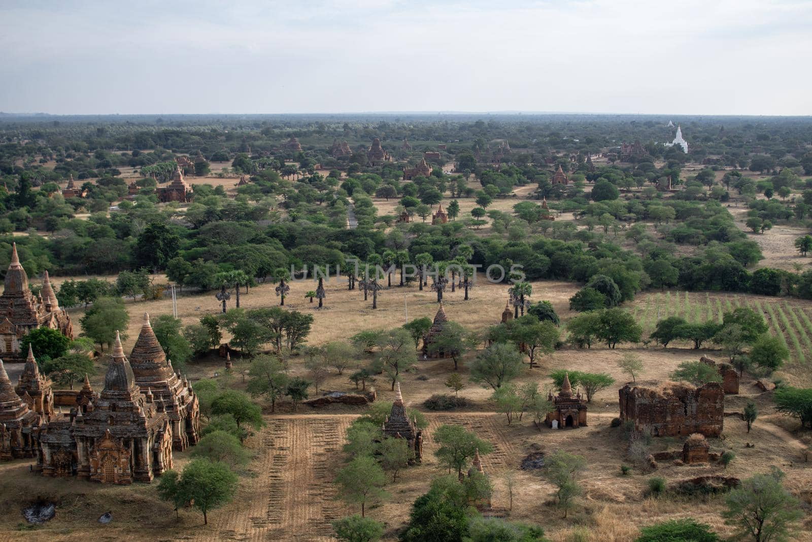 BAGAN, NYAUNG-U, MYANMAR - 3 JANUARY 2020: Looking out over the vast plains of Bagan with its historical temples and fields from the tall Nan Myint viewing tower