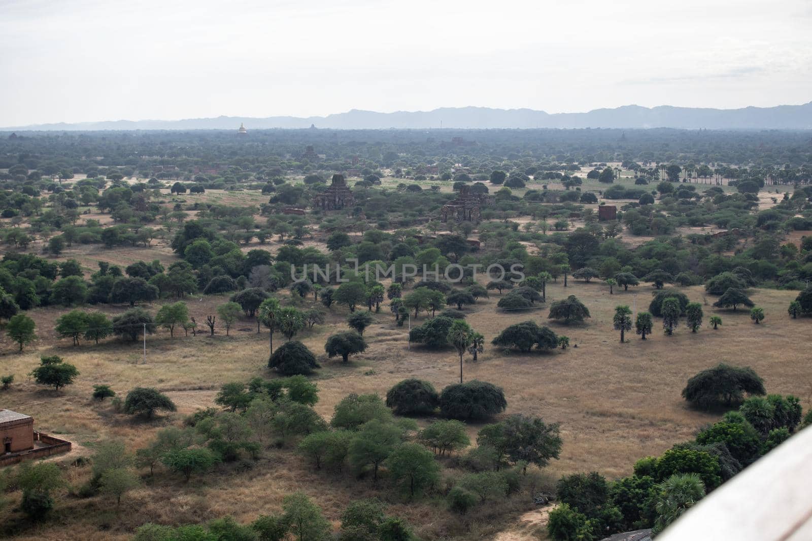 BAGAN, NYAUNG-U, MYANMAR - 3 JANUARY 2020: Looking out over the vast plains of Bagan with its historical temples and fields from the tall Nan Myint viewing tower