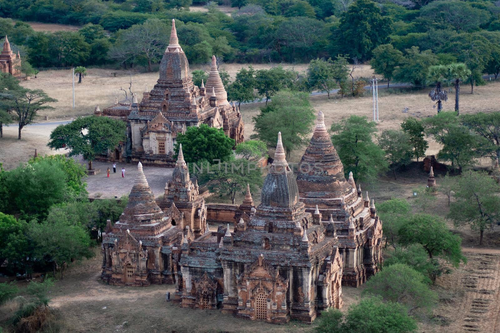 BAGAN, NYAUNG-U, MYANMAR - 3 JANUARY 2020: Looking out over a few old historical and religious temples from the tall Nan Myint viewing tower