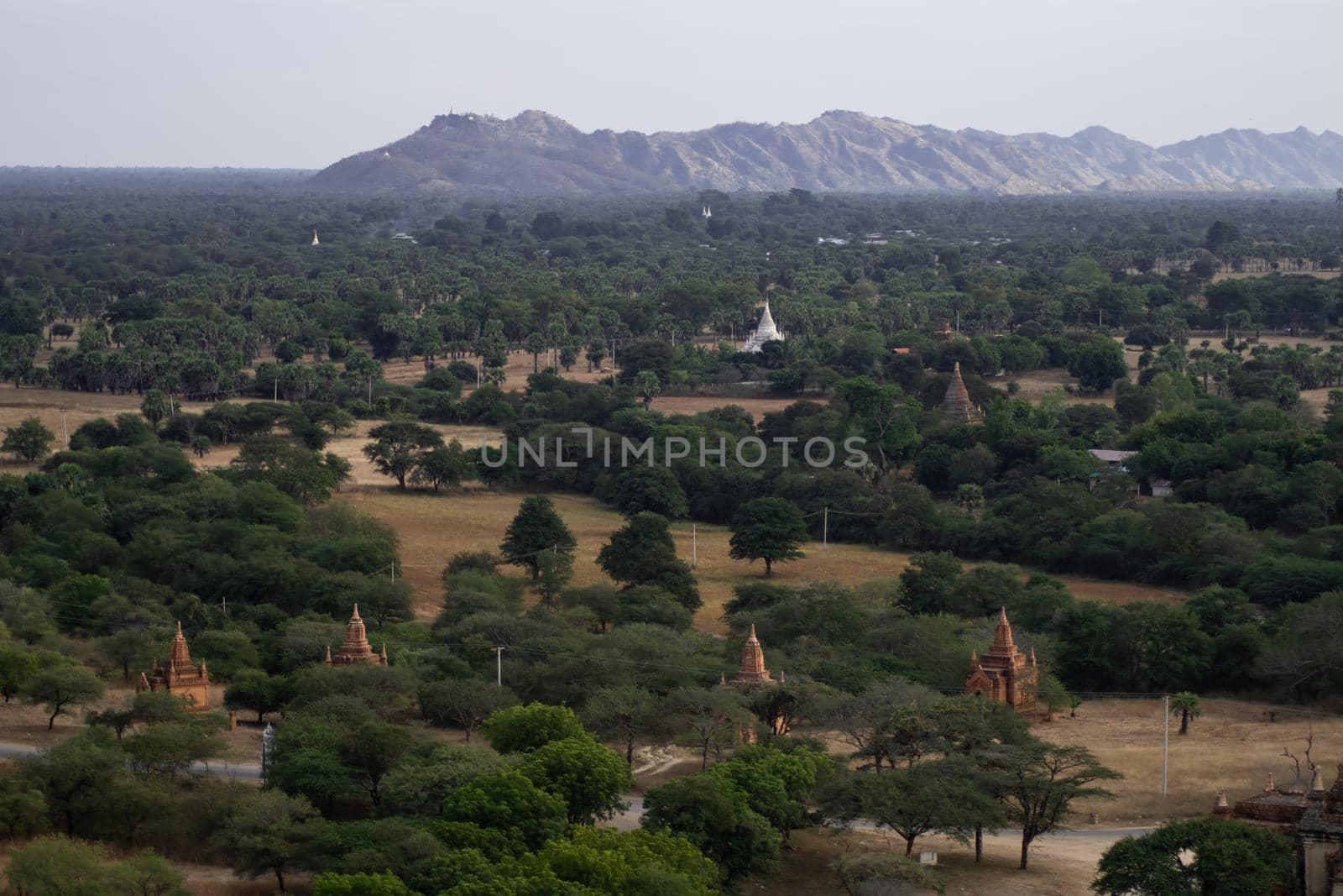 BAGAN, NYAUNG-U, MYANMAR - 3 JANUARY 2020: Looking out over the vast plains of Bagan with its historical temples and fields from the tall Nan Myint viewing tower