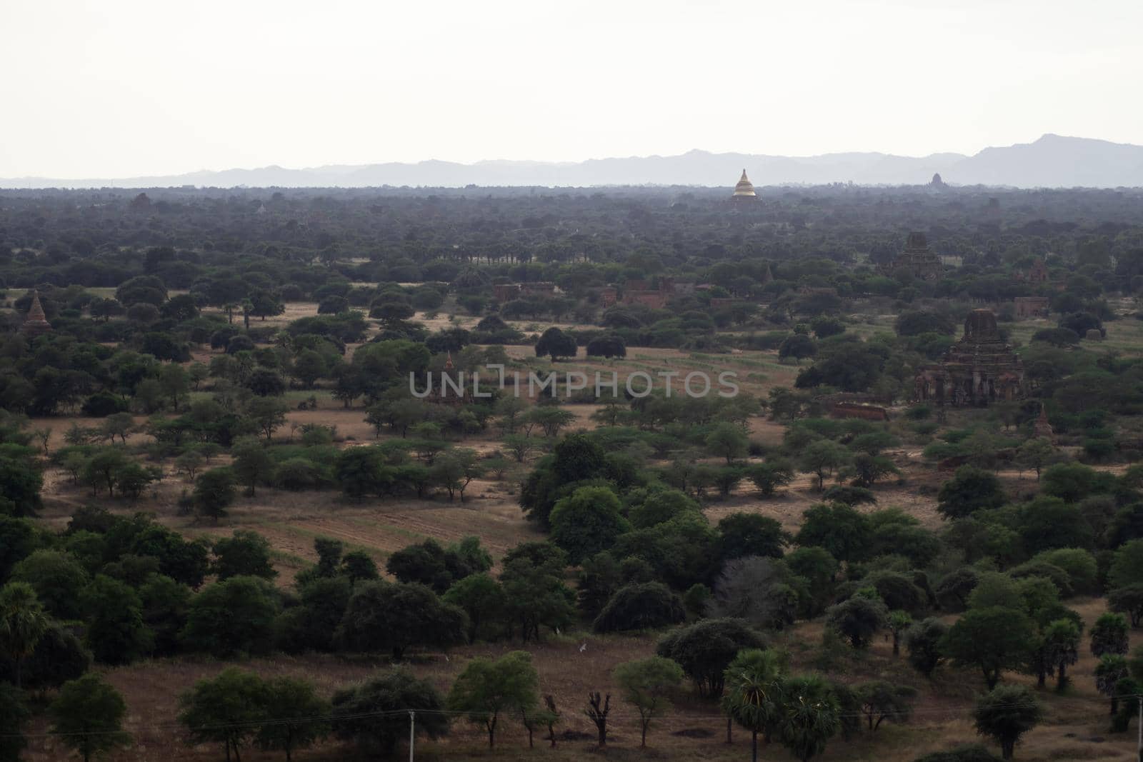 BAGAN, NYAUNG-U, MYANMAR - 3 JANUARY 2020: Looking out over the vast plains of Bagan with its historical temples and fields from the tall Nan Myint viewing tower