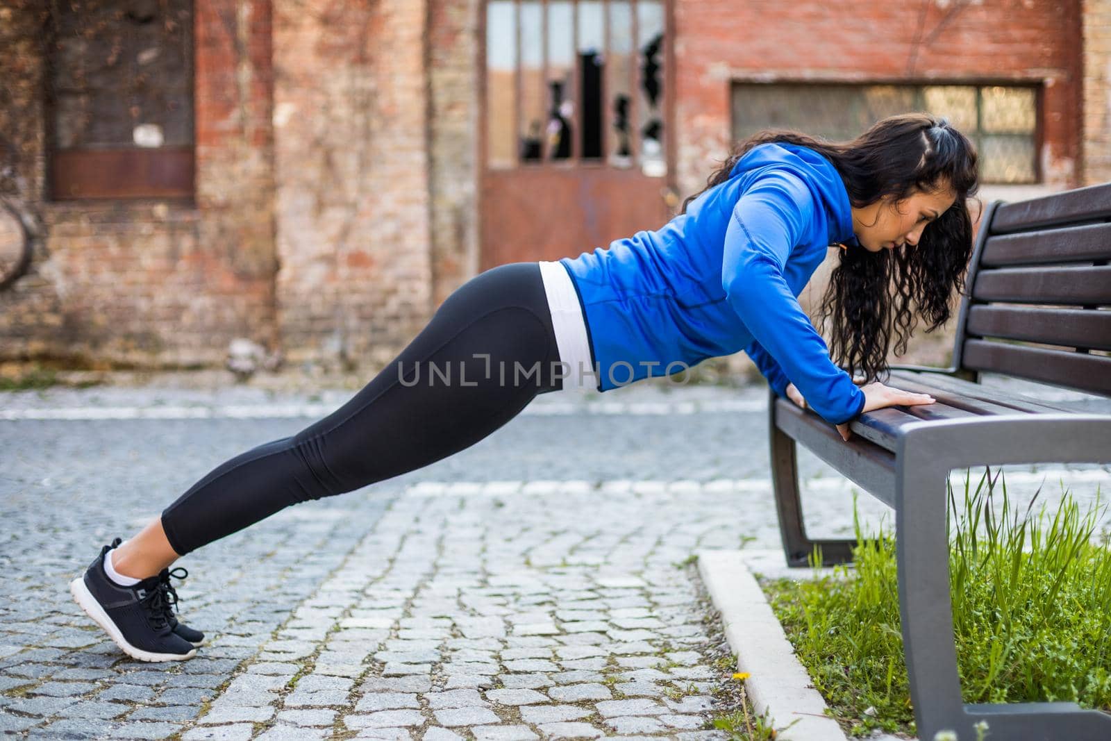 Woman exercising outdoor by Bazdar