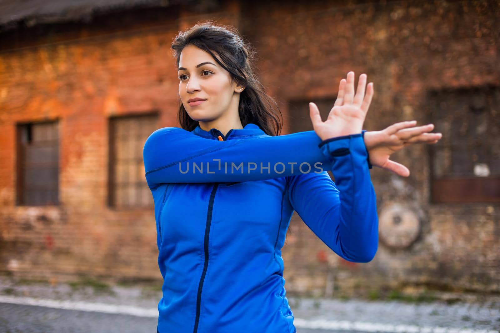 Beautiful woman enjoys  exercising outdoor.