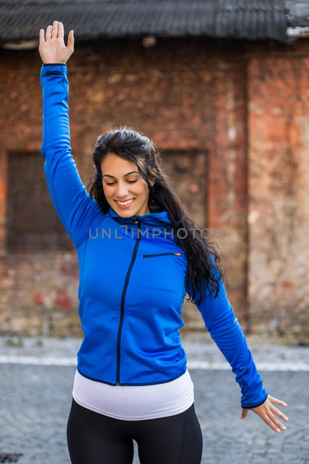 Beautiful woman enjoys  exercising outdoor.