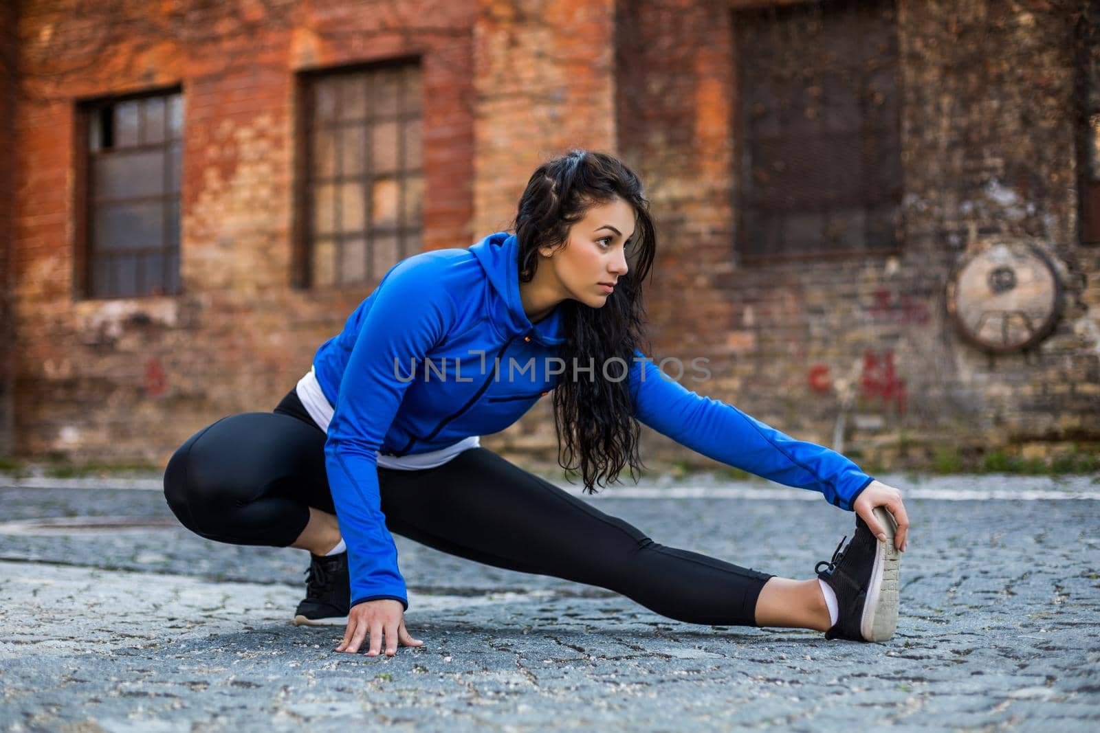 Beautiful woman enjoys  exercising outdoor.