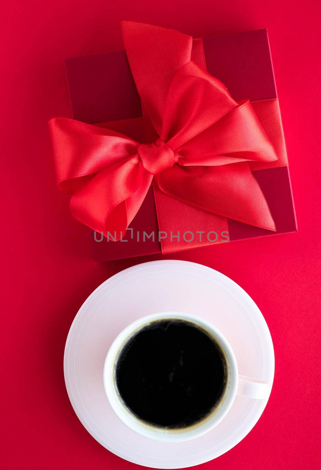 Romantic celebration, lifestyle and birthday present concept - Luxury beauty gift box and coffee on red, flatlay