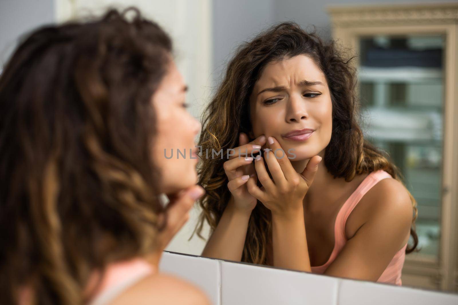 Woman squeezing pimple by Bazdar