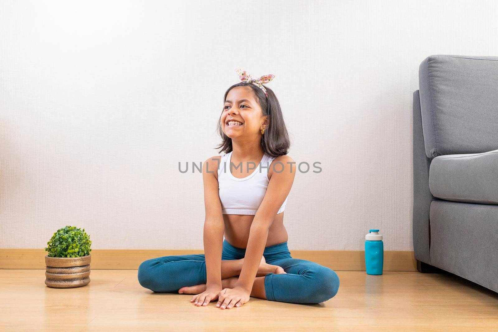 Teen girl doing yoga at home by eagg13