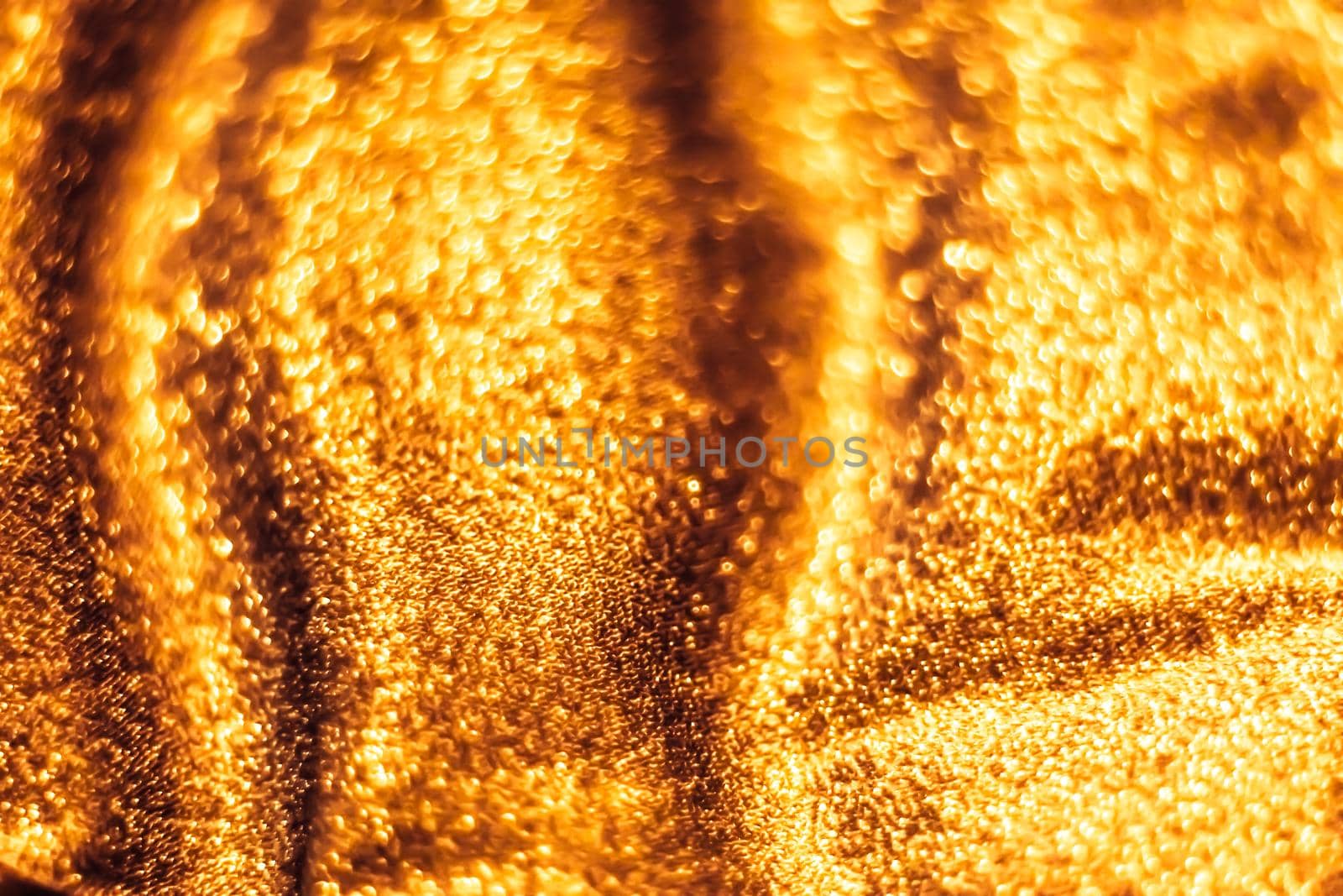 Luxe glowing texture, night club branding and New Years party concept - Golden holiday sparkling glitter abstract background, luxury shiny fabric material for glamour design and festive invitation