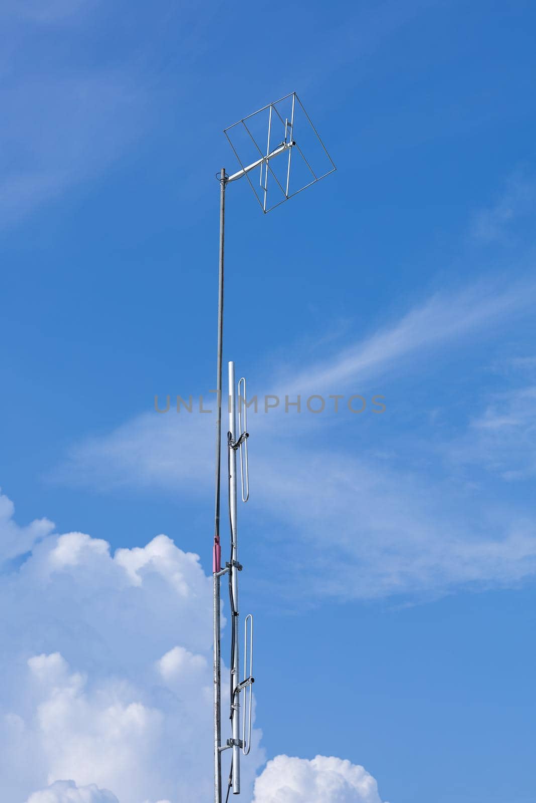 Small antenna repeater on blue sky by smuay