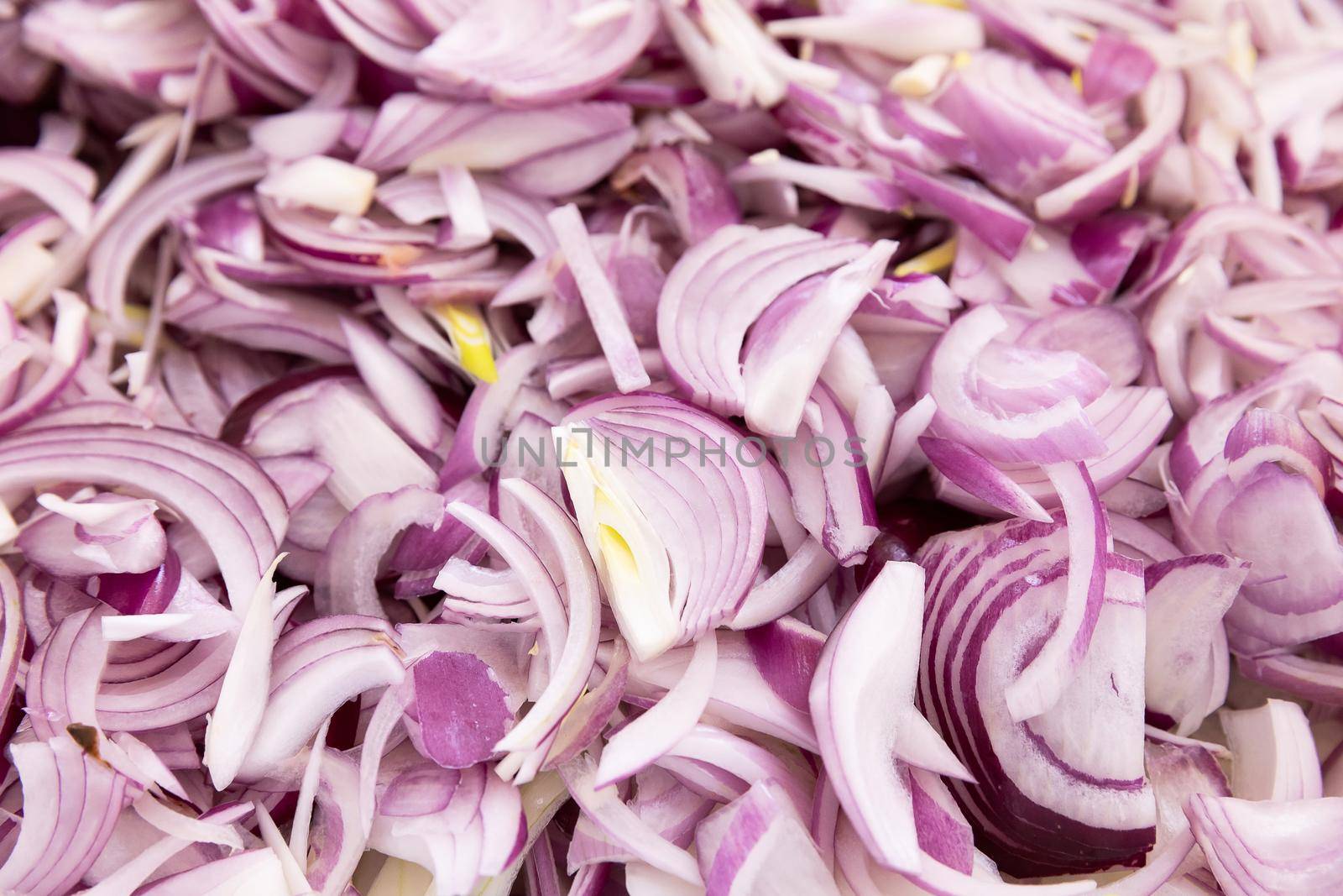 Red color indian onion sliced or chopped ready for cook, vegetable background, hot and spicy