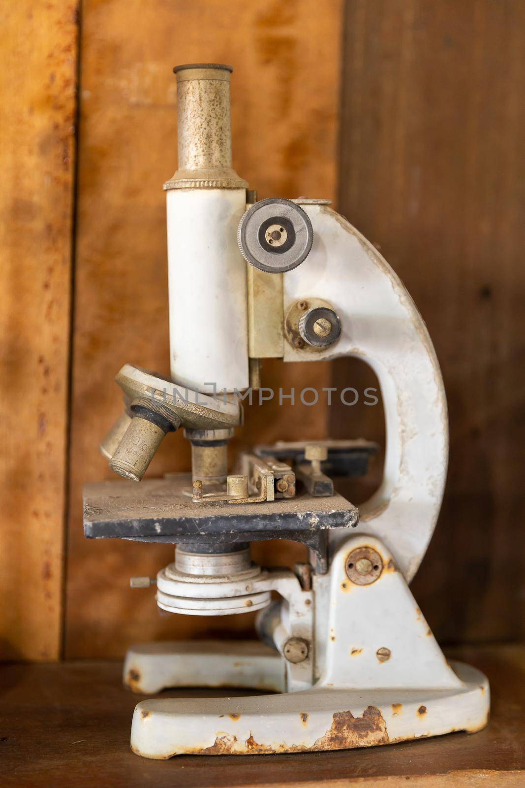 Closeup old rusty and dirty ancient microscope 