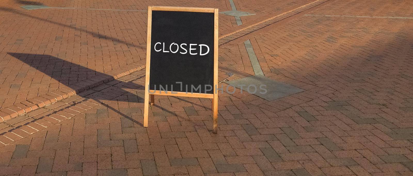 Closed sign on blackboard during covid 19 lockdown