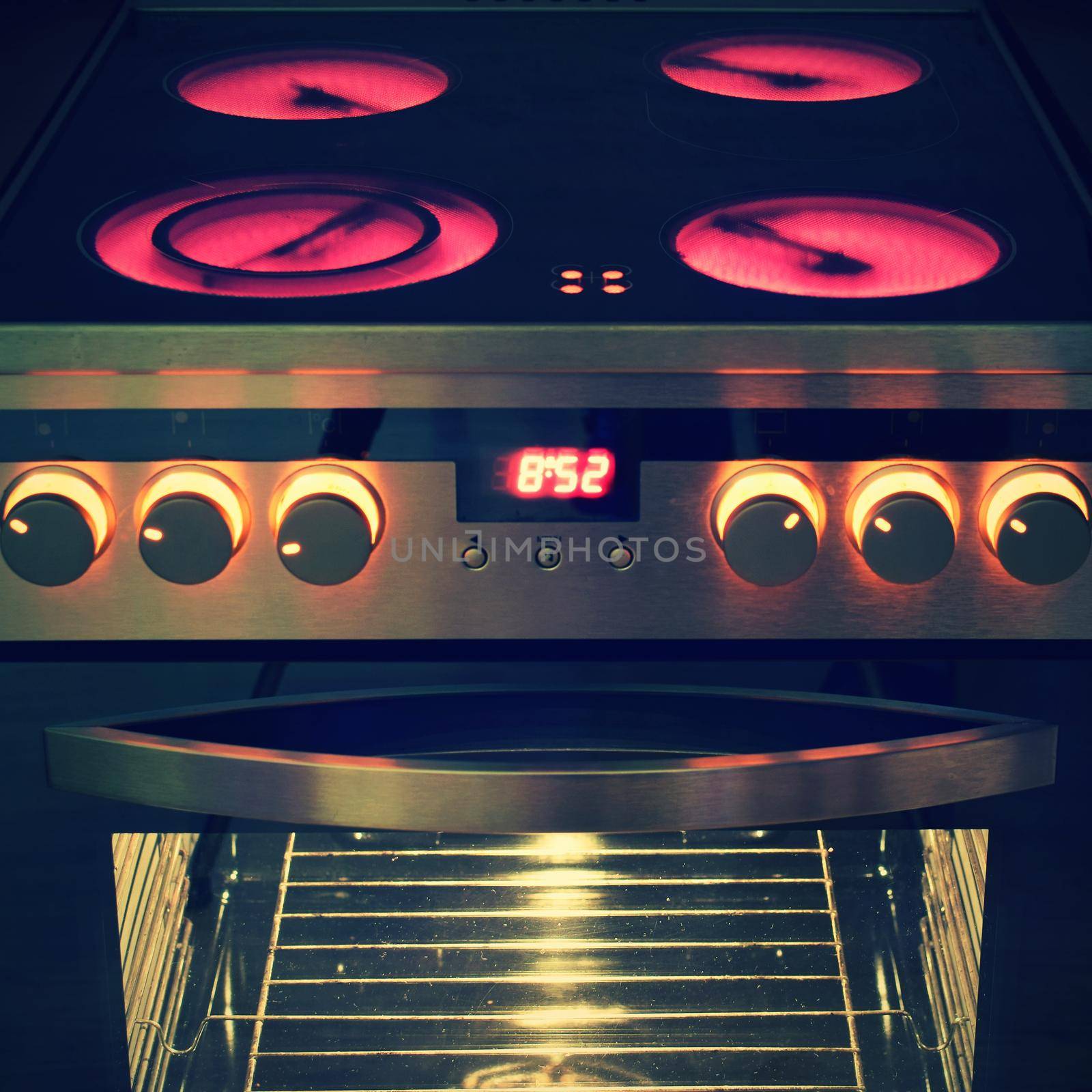 Electric ceramic stove inside the kitchen. Nice detail of a home appliance in a house interior. by Montypeter