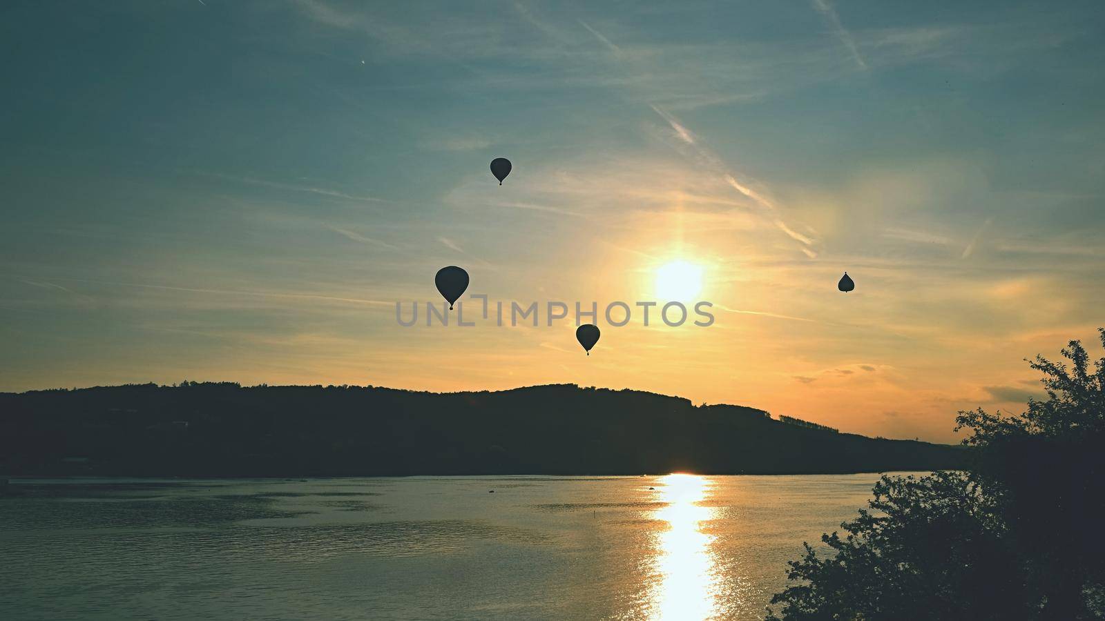 Beautiful colorful hot air balloon is flying at sunset. Brno Dam - Czech Republic.