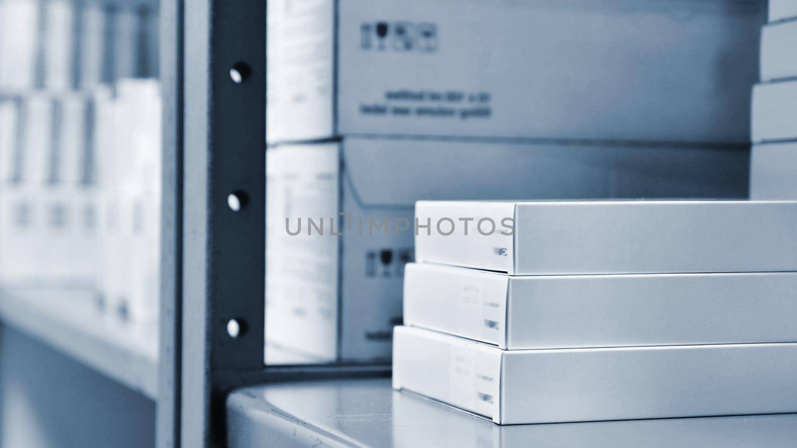 Drug boxes in a shelf in a pharmacy. Store of medicines and vitamins. Background for sale in a pharmacy and Concept for medicine and health - Coronavirus - COVID 19. by Montypeter