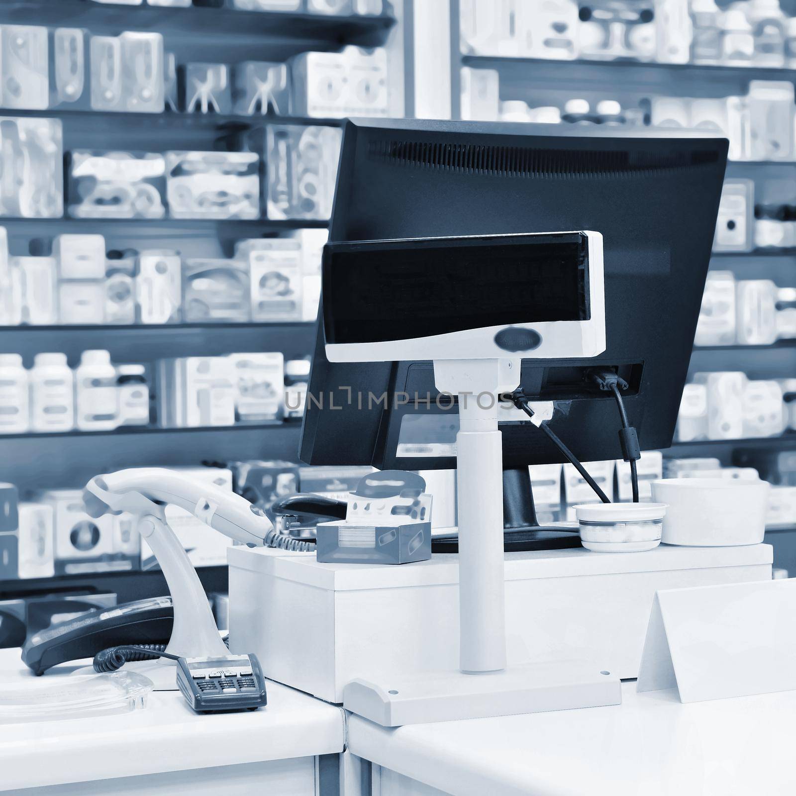 Cash desk - computer and monitor in a pharmacy. Interior of drug and vitamins shop. Concept for medicine and health - Coronavirus - COVID 19.
