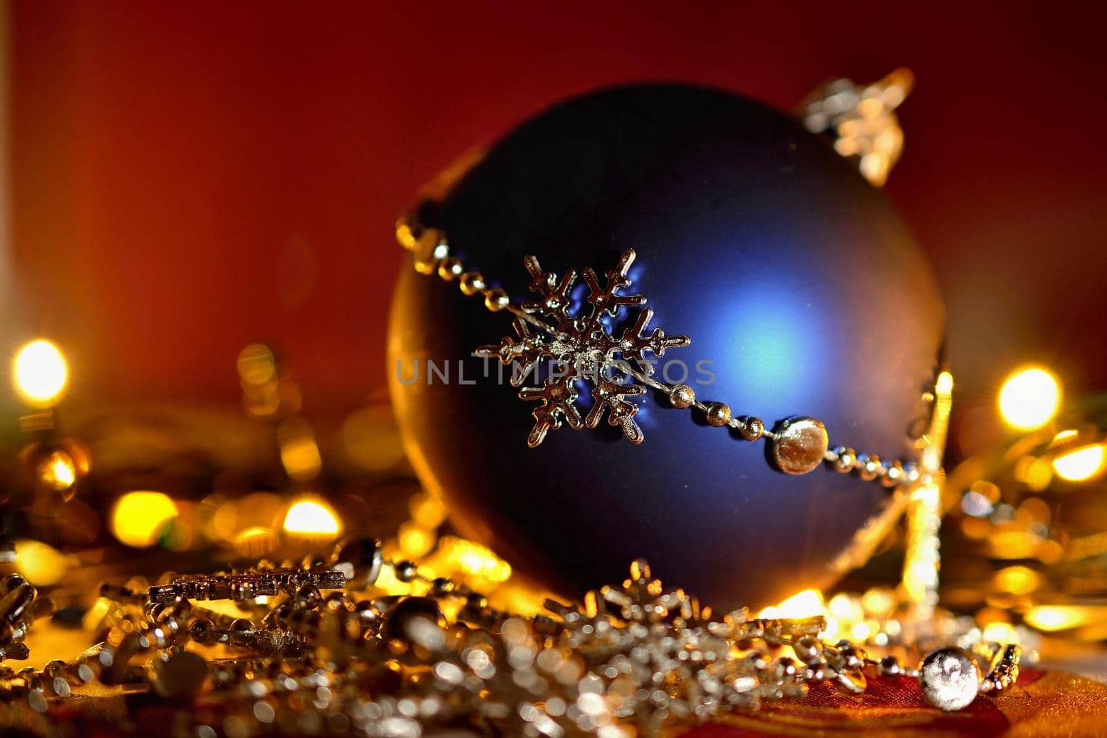 Colorful christmas Decoration. Winter holidays and traditional ornaments on a Christmas tree. Lighting chains - candles for seasonal background.