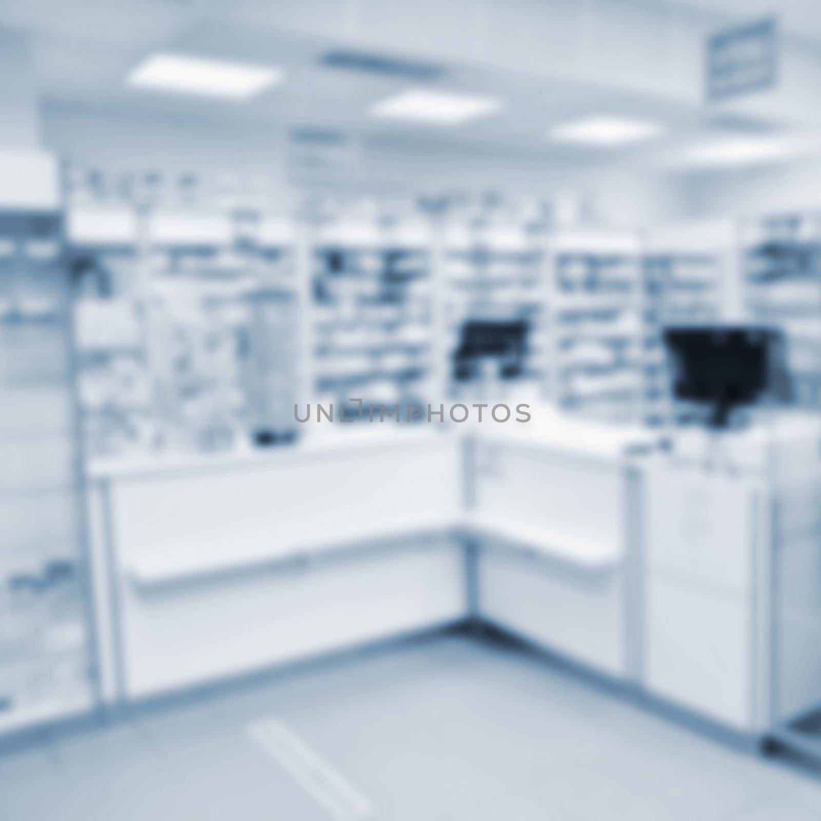 Blurred background. Interior of a pharmacy with goods and showcases. Medicines and vitamins for health. Shop concept, medicine and healthy lifestyle. by Montypeter
