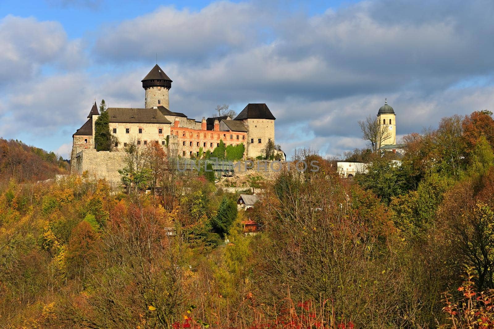 Beautiful old romantic castle Sovinec at sunset with autumn landscape.