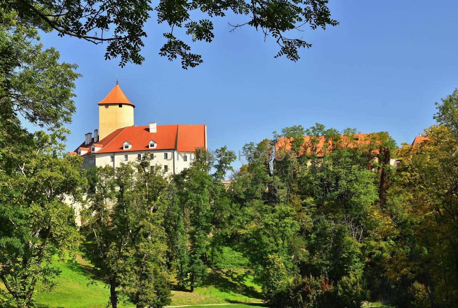 Beautiful Gothic castle Veveri. The city of Brno at the Brno dam. South Moravia - Czech Republic - Central Europe. by Montypeter