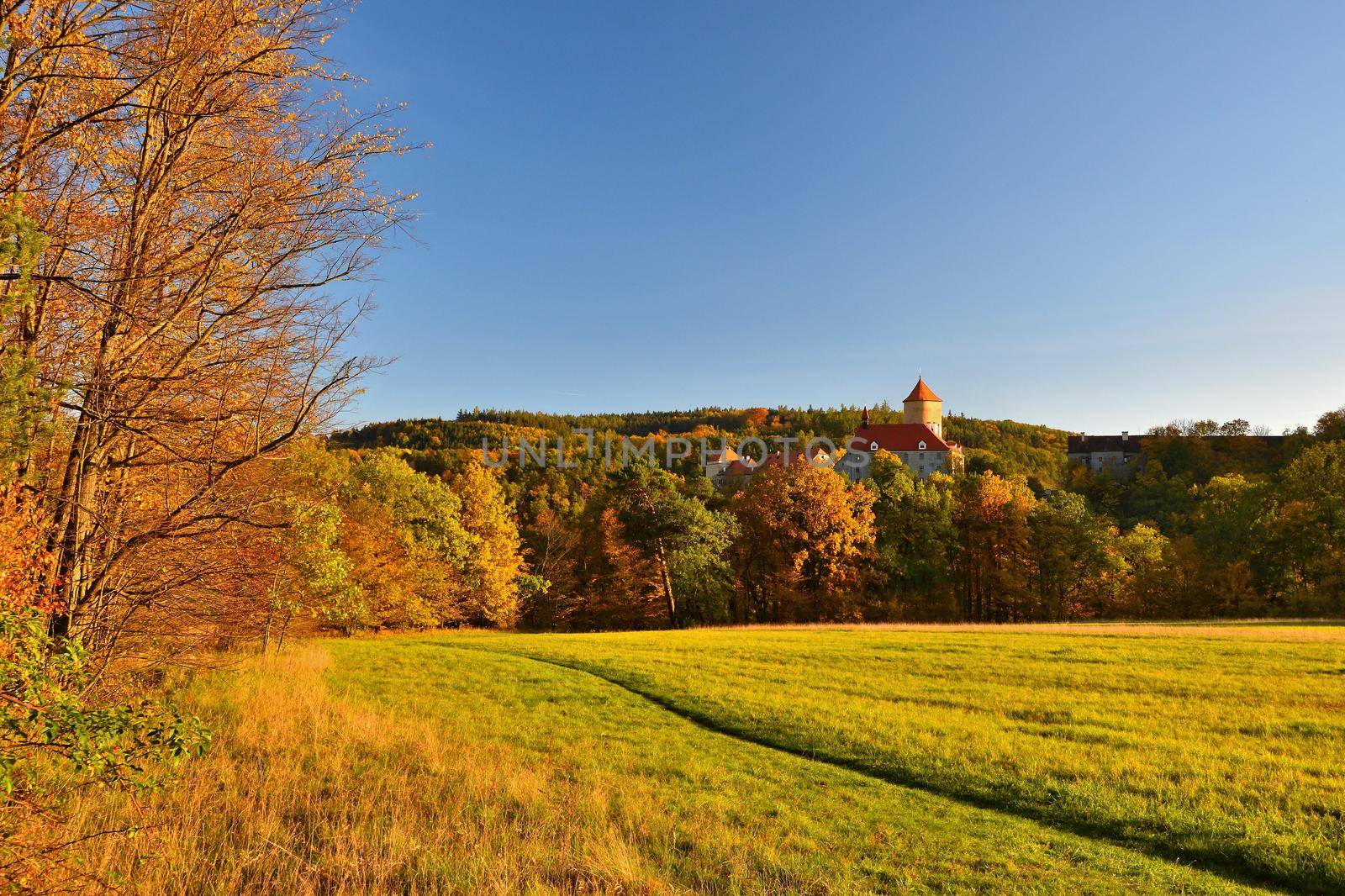 Beautiful Autumn Landscape with Veveri Castle. Natural colorful scenery with sunset. Brno dam-Czech Republic-Europe. by Montypeter