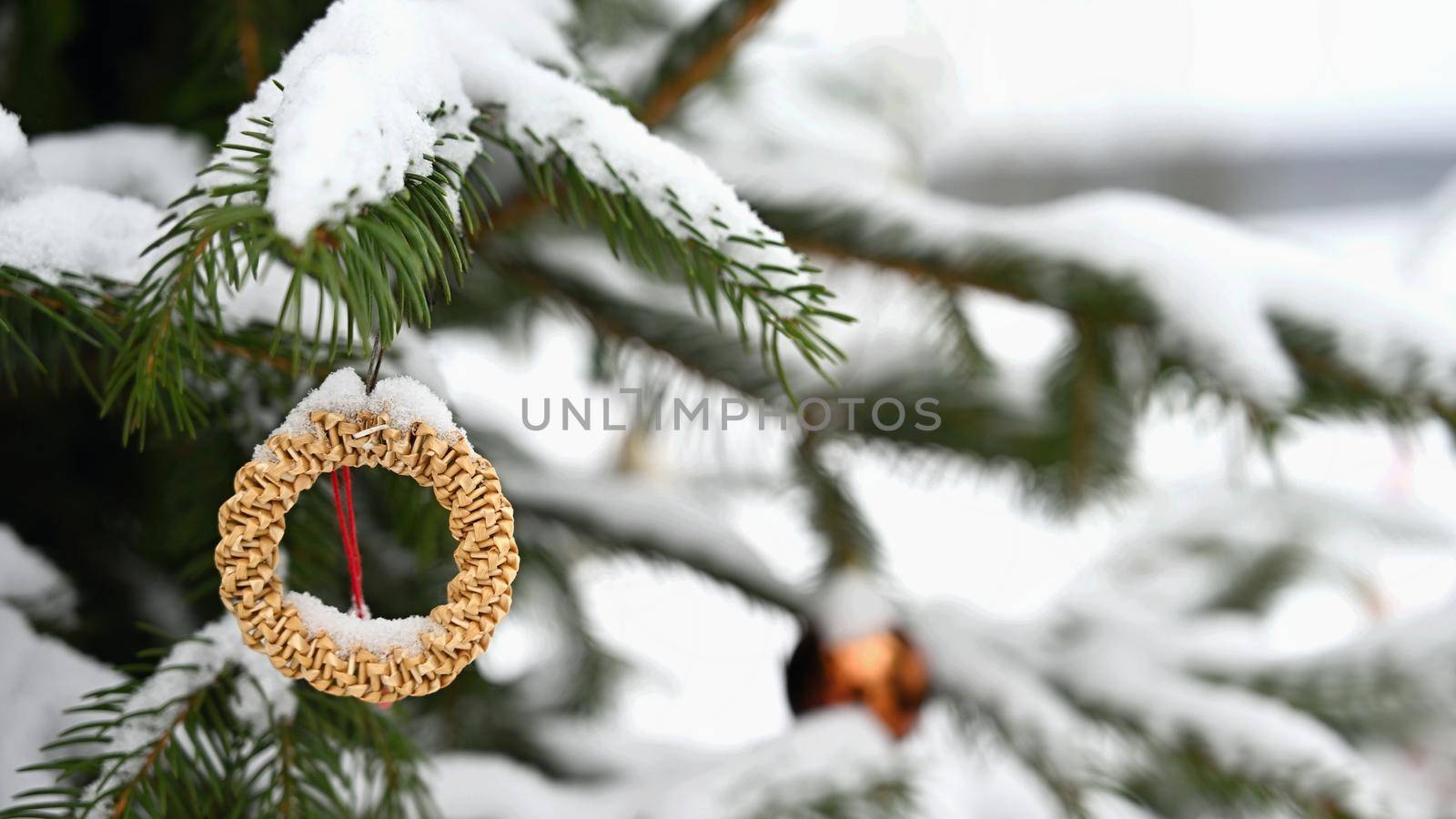 Christmas tree decorations. Snow on the branches. Concept for Christmas and Winter Time.