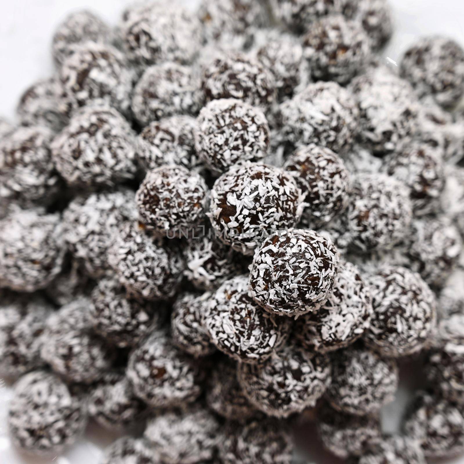 Rum balls in coconut. Classic Czech Christmas cookies. Hand made unbaked sweets with alcohol.