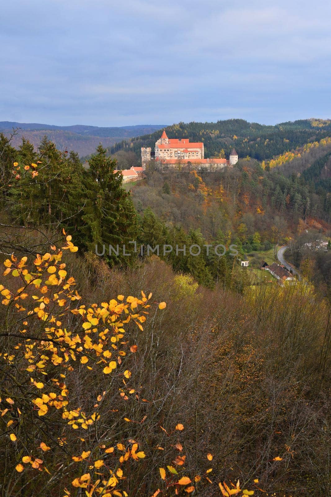 Beautiful old castle in forests with autumn landscape. Castle Pernstejn - Nedvedice. Europe Czech Republic.