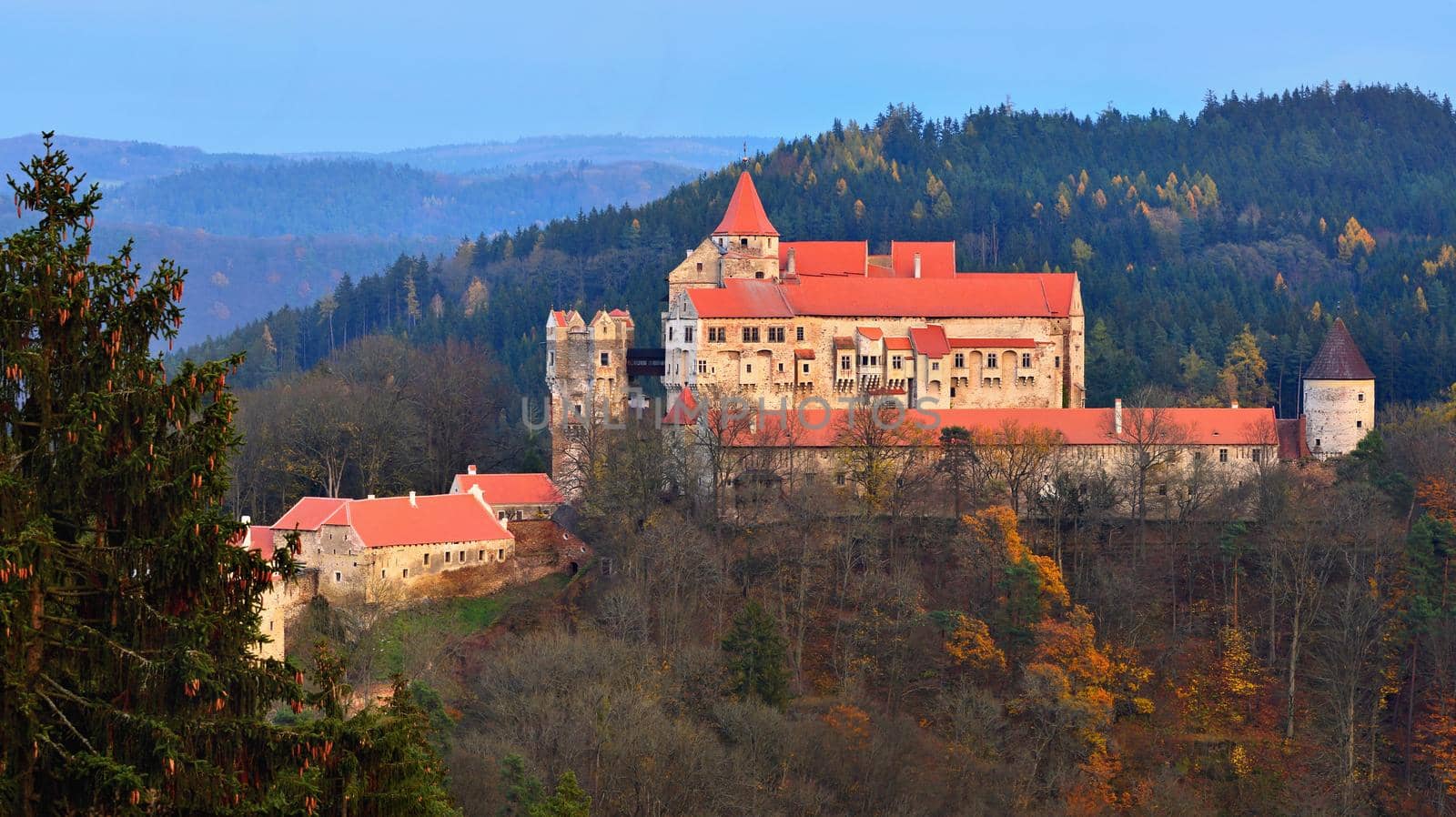 Beautiful old castle in forests with autumn landscape. Castle Pernstejn - Nedvedice. Europe Czech Republic.